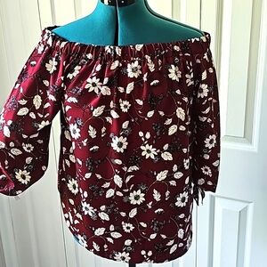 Off the shoulder shirt. Slit sleeves with bows. Size M by First Love